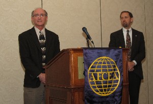 In April, Dr. Sam Richie (l), executive director, Florida Science Olympiad, receives a check from the AFCEA International Educational Foundation for Florida Science Olympiad from Dr. Roger Smith, former chapter president.